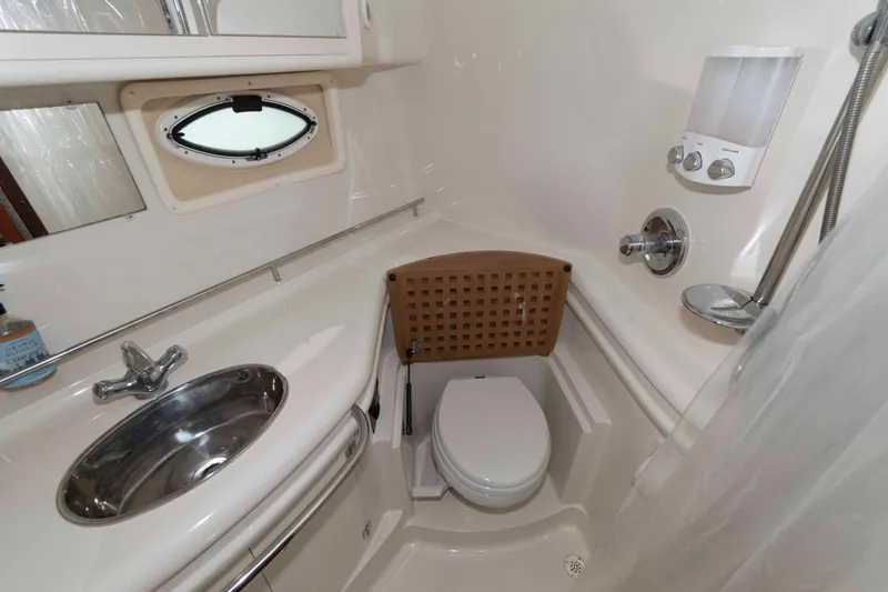 Slide: The Image of Bathroom interior of 2008 Monterey 350 Sport Yacht with sink, toilet, and shower. - 19