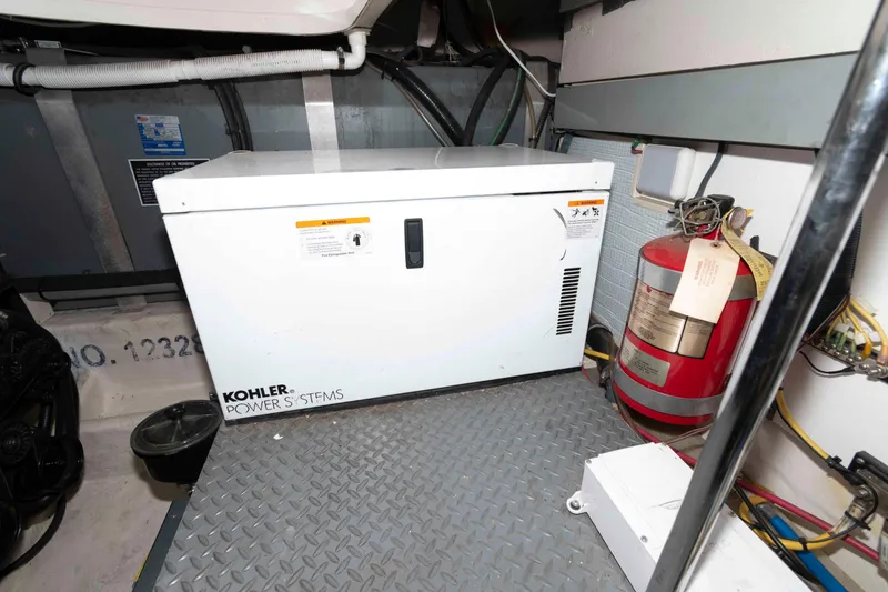 Slide: The Image of Engine room of 2008 Monterey 350 Sport Yacht with Kohler power system and fire extinguisher. - 21