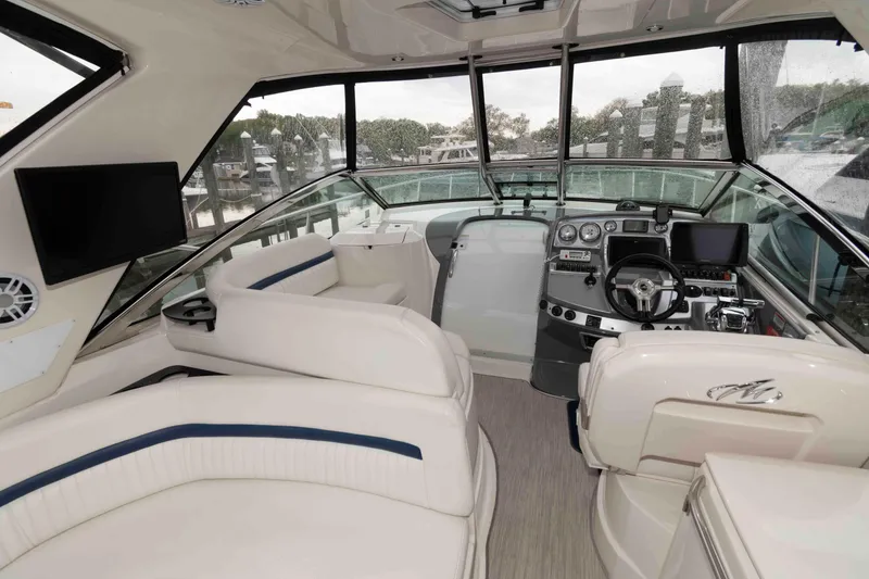 Slide: The Image of Interior of a 2008 Monterey 350 Sport Yacht with modern helm and seating. - 5