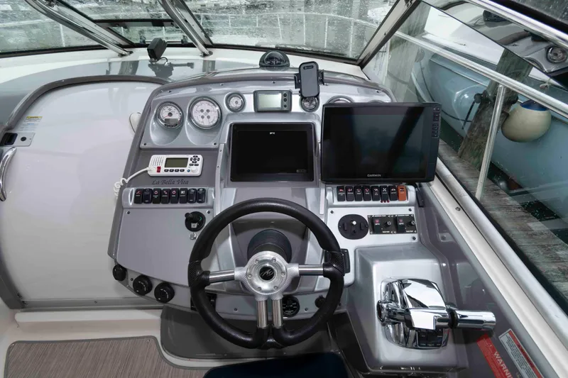 Slide: The Image of Cockpit of 2008 Monterey 350 Sport Yacht with steering wheel and navigation controls. - 8