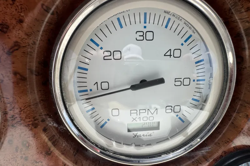 Slide: The Image of Close-up of a tachometer on a 2003 Silverton 39 Motor Yacht dashboard. - 19