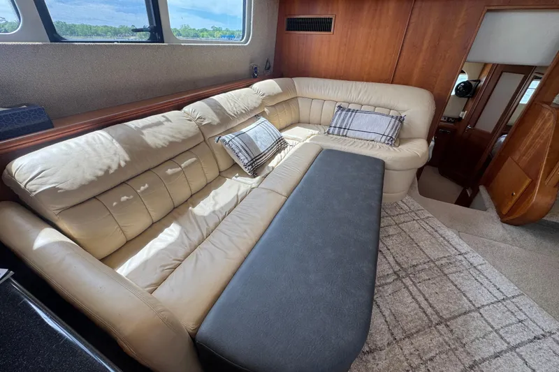 Slide: The Image of Luxurious interior of 2003 Silverton 39 Motor Yacht with beige leather seating. - 28