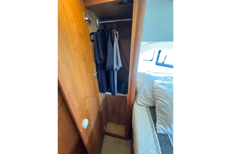 Slide: The Image of Wooden closet and bed inside 2003 Silverton 39 Motor Yacht cabin. - 36