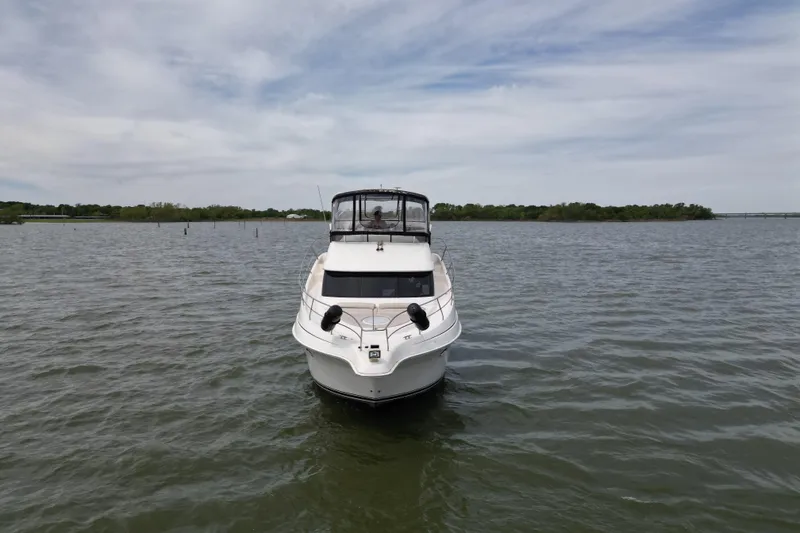 Slide: The Image of 2003 Silverton 39 Motor Yacht on calm water under cloudy sky. - 4