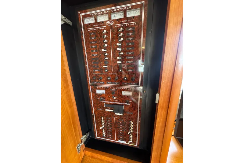 Slide: The Image of Electrical control panel on a 2003 Silverton 39 Motor Yacht, featuring 12V and 240V systems. - 43