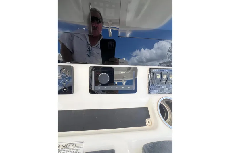 Slide: The Image of 2016 Regulator 34 Center Console dashboard with controls and reflection. - 19