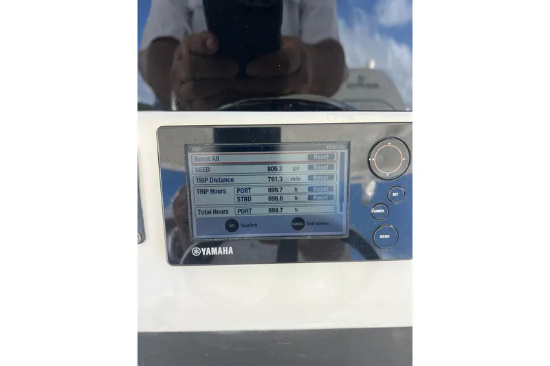 Slide: The Image of Yamaha display on 2016 Regulator 34 Center Console showing trip data and hours. - 23
