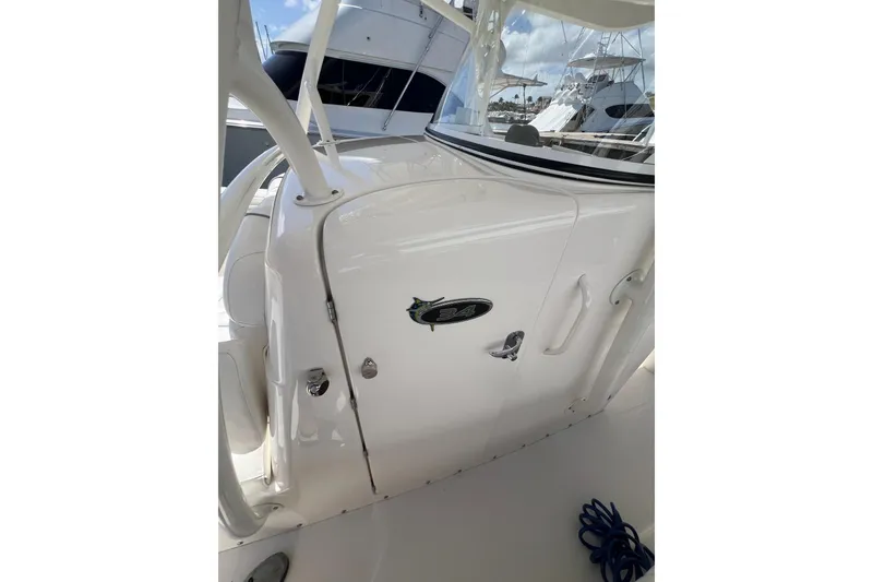 Slide: The Image of 2016 Regulator 34 Center Console boat with sleek white design and visible logo. - 24