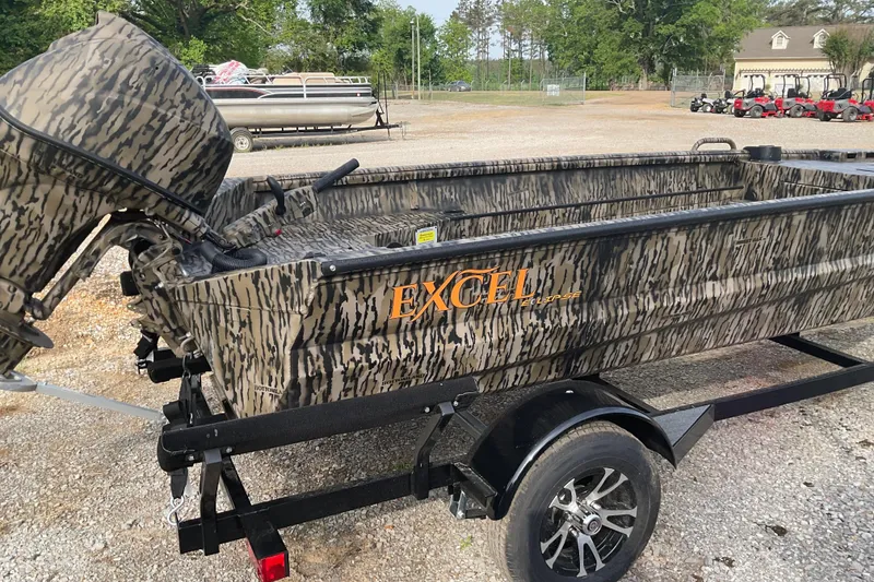 Slide: The Image of 2026 Excel Eclipse 1754 boat with camouflage design on a trailer in a parking lot. - 4