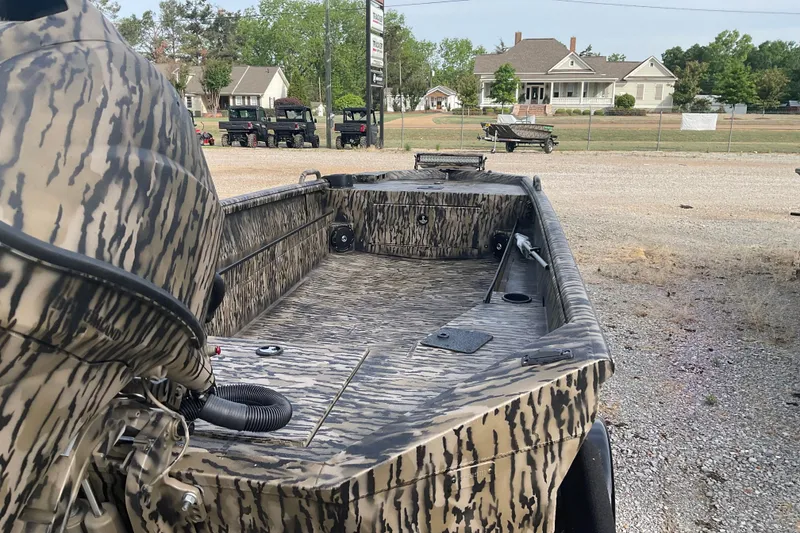 Slide: The Image of Camouflage-patterned 2026 Excel Eclipse 1754 boat parked outdoors. - 5