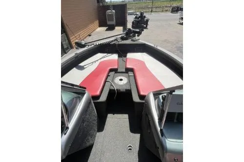 Slide: The Image of 2010 Lowe Fish & Ski 175 boat interior with red and white seating. - 3