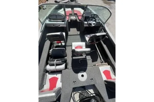Slide: The Image of 2010 Lowe Fish & Ski 175 boat interior with seating and dashboard view. - 4