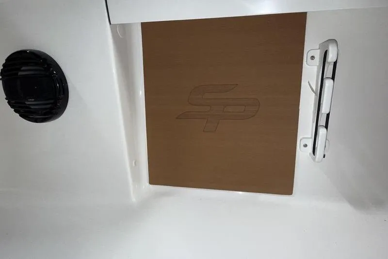 Slide: The Image of 2026 Sea Pro 210 Bay boat interior with speaker and logo detail. - 14