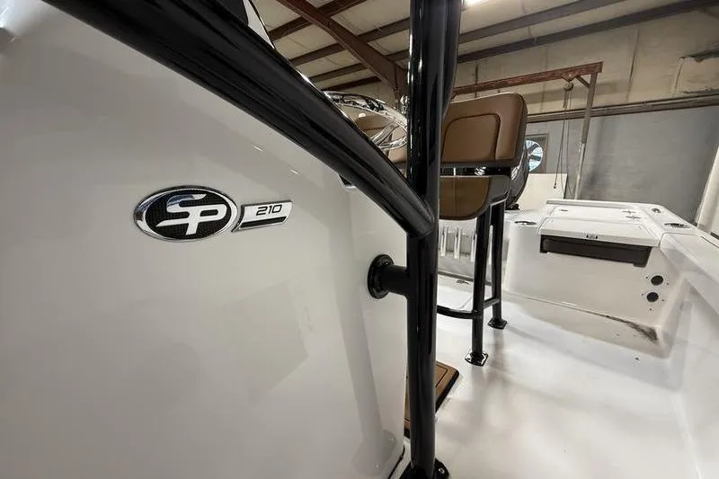Slide: The Image of 2026 Sea Pro 210 Bay boat interior with logo and seating detail. - 15