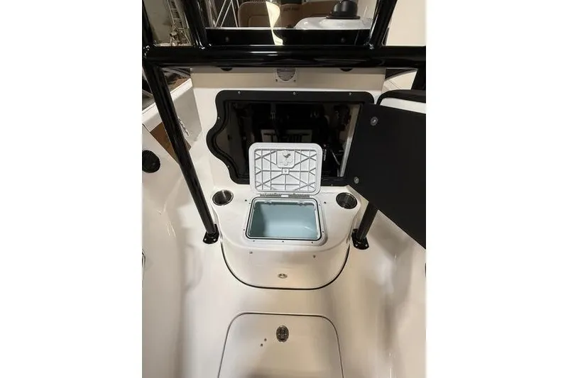 Slide: The Image of 2026 Sea Pro 210 Bay boat interior with open storage compartments. - 18