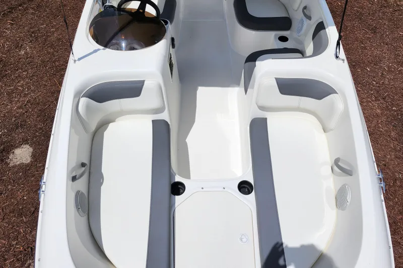 Slide: The Image of 2021 Bayliner Element E18 boat interior with white and gray seating. - 22