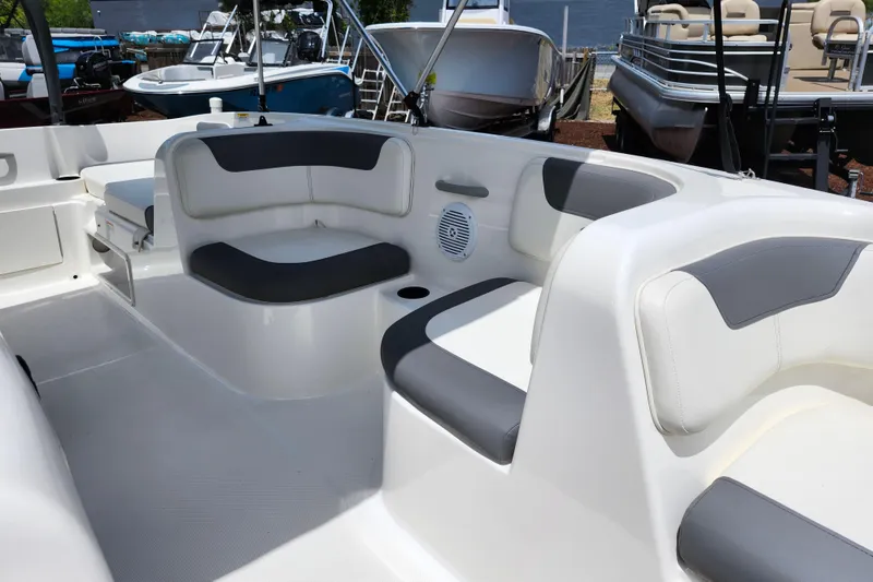 Slide: The Image of 2021 Bayliner Element E18 boat interior with gray and white seating. - 24