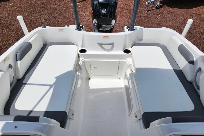 Slide: The Image of 2021 Bayliner Element E18 boat interior with spacious seating and modern design. - 27