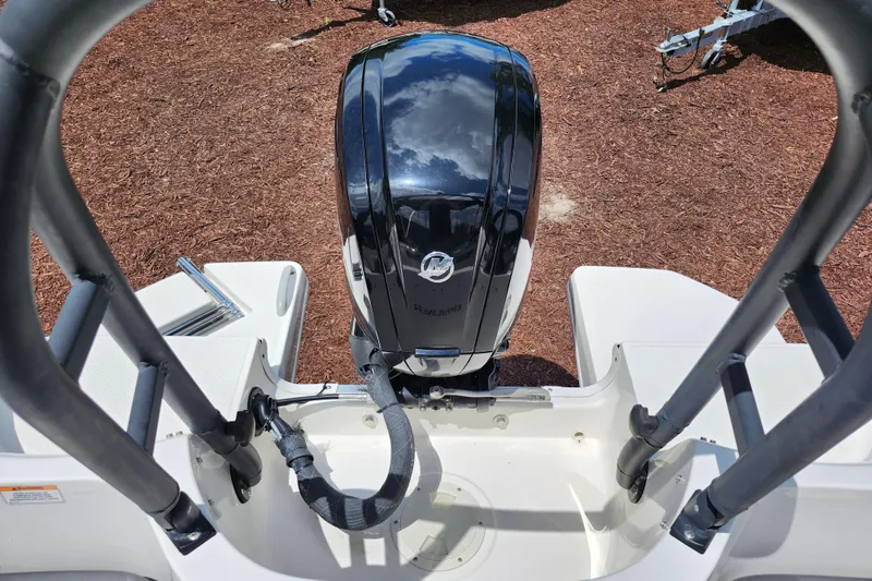 Slide: The Image of 2021 Bayliner Element E18 boat with Mercury outboard motor, viewed from the rear deck. - 31