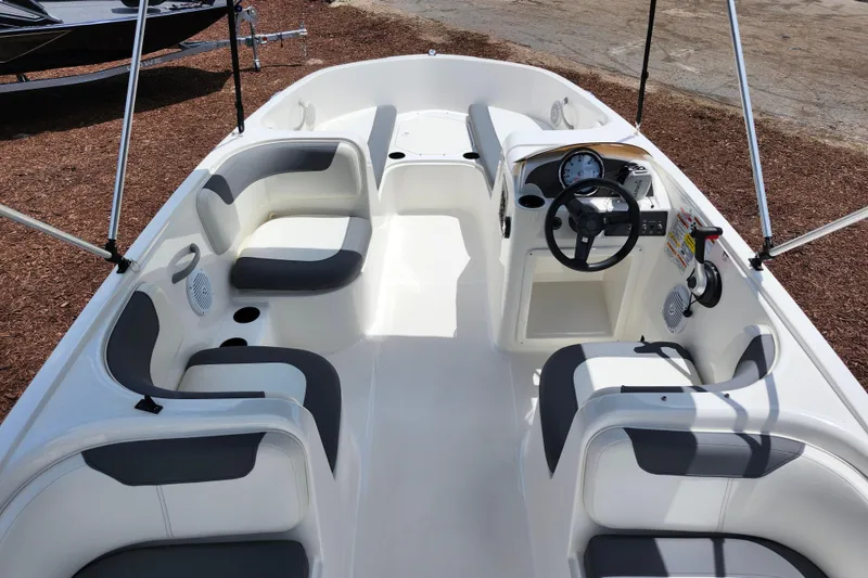 Slide: The Image of 2021 Bayliner Element E18 boat interior with seating and steering console. - 35