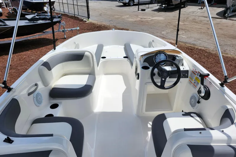 Slide: The Image of 2021 Bayliner Element E18 boat interior with seating and steering console. - 39