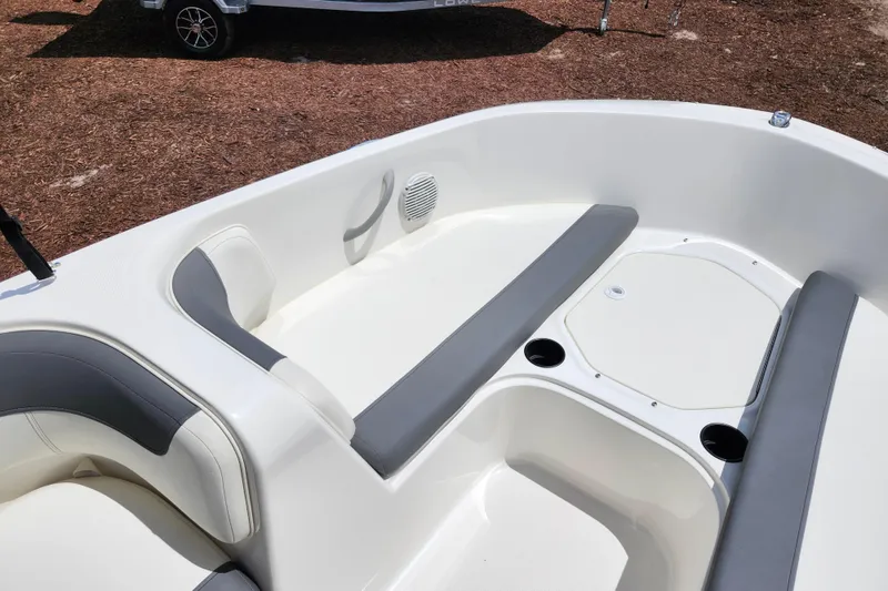 Slide: The Image of 2021 Bayliner Element E18 boat interior with gray seating and storage compartments. - 41