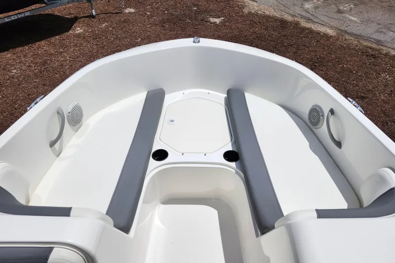 Slide: The Image of 2021 Bayliner Element E18 boat interior with gray seating and cup holders. - 43