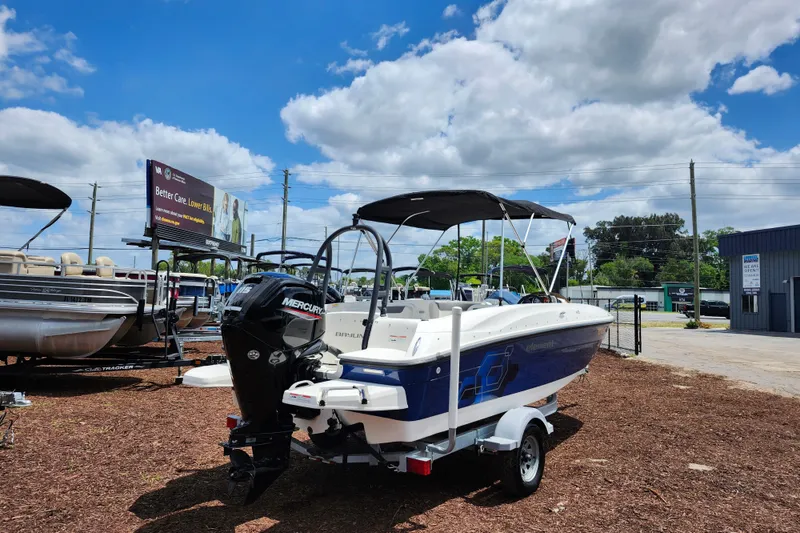 Slide: The Image of 2021 Bayliner Element E18 boat on trailer under blue sky. - 7