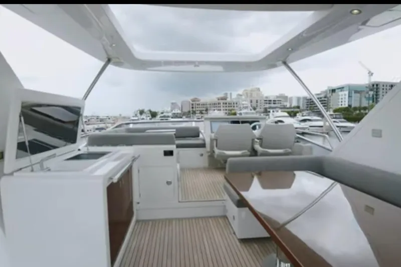 Slide: The Image of Luxurious 2017 Azimut 66 yacht interior with modern seating and sleek design. - 29