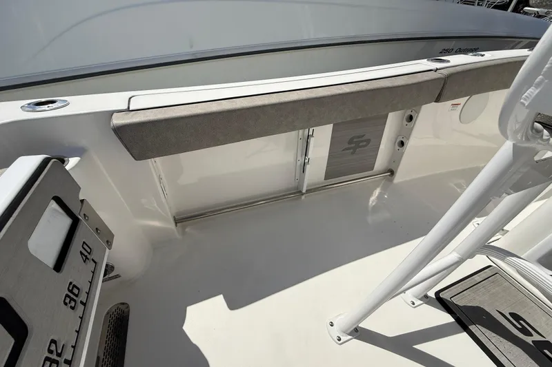 Slide: The Image of 2023 Sea Pro 219 Center Console boat interior with seating and storage compartments. - 14