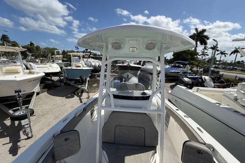 Slide: The Image of 2023 Sea Pro 219 Center Console boat displayed in a sunny marina setting. - 16