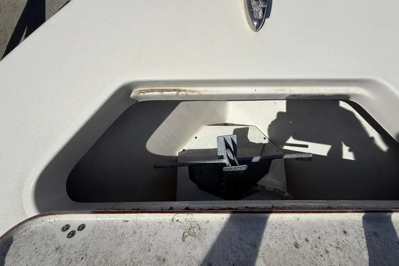 Slide: The Image of Anchor compartment of 2023 Sea Pro 219 Center Console boat, featuring a neatly stored anchor. - 19