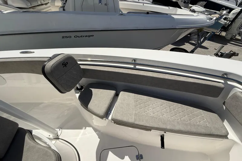 Slide: The Image of 2023 Sea Pro 219 Center Console boat interior with cushioned seating and sleek design. - 20