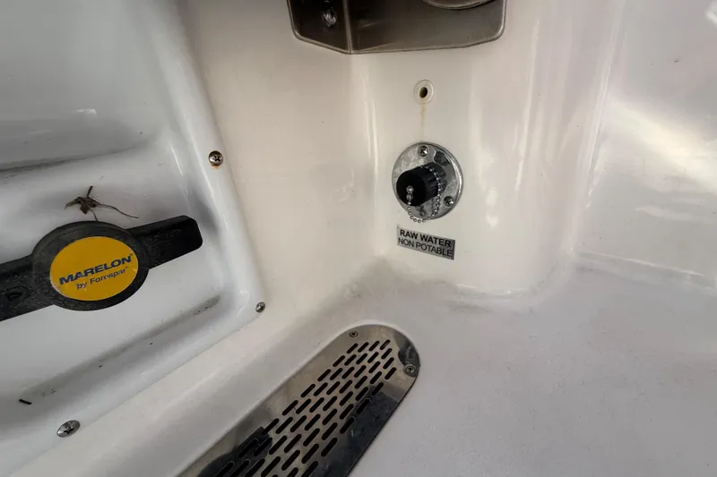 Slide: The Image of 2023 Sea Pro 219 Center Console boat interior with Marelon valve and non-potable water label. - 23