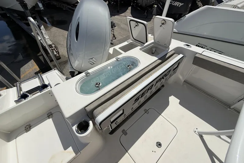 Slide: The Image of 2023 Sea Pro 219 Center Console boat interior with storage compartments and seating. - 3