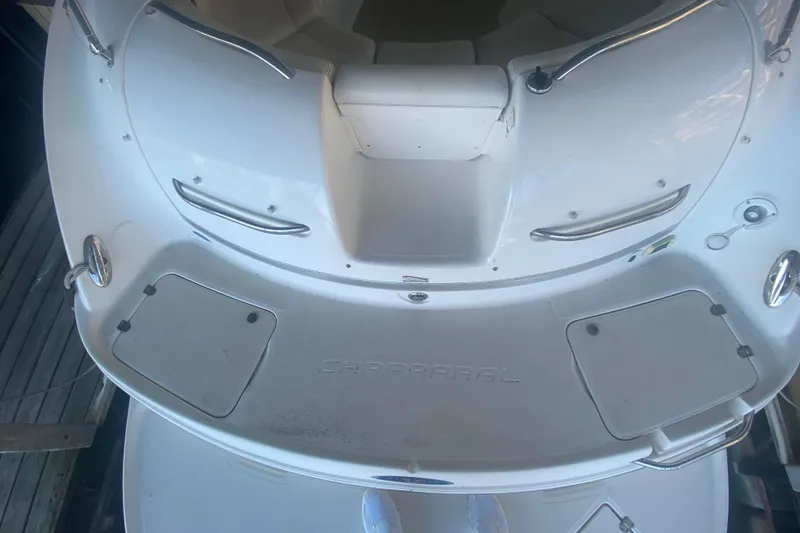 Slide: The Image of 2003 Chaparral Sunesta 263 boat deck with seating and stainless steel railings. - 12