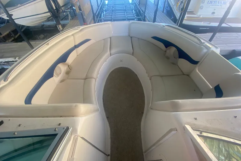 Slide: The Image of 2003 Chaparral Sunesta 263 boat interior with white and blue seating. - 30