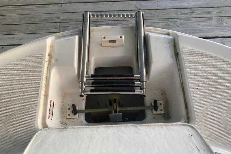 Slide: The Image of 2003 Chaparral Sunesta 263 boat ladder on deck, showing stainless steel construction. - 33