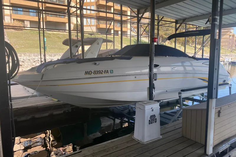 Slide: The Image of 2003 Chaparral Sunesta 263 boat docked in a covered marina. - 35