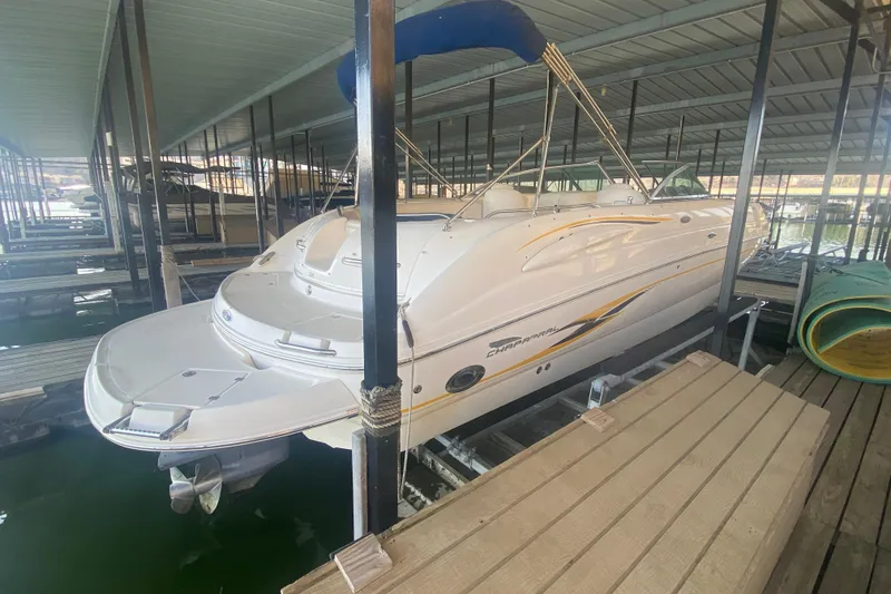 Slide: The Image of 2003 Chaparral Sunesta 263 boat docked in a covered marina. - 4