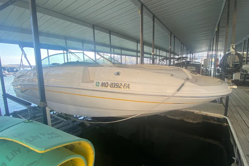 Slide: The Image of 2003 Chaparral Sunesta 263 boat docked in covered marina. - 5
