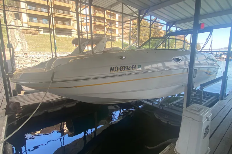 Slide: The Image of 2003 Chaparral Sunesta 263 boat docked in a covered marina slip. - 7