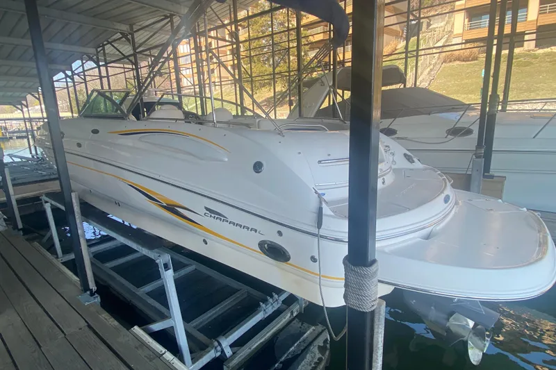 Slide: The Image of 2003 Chaparral Sunesta 263 boat docked in a covered marina. - 8