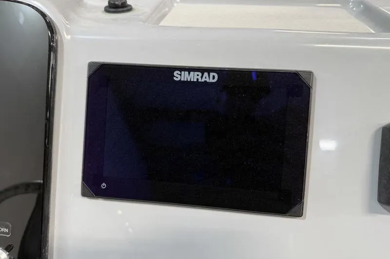 Slide: The Image of Simrad display on 2026 Sea Pro 210 Bay boat dashboard. - 13