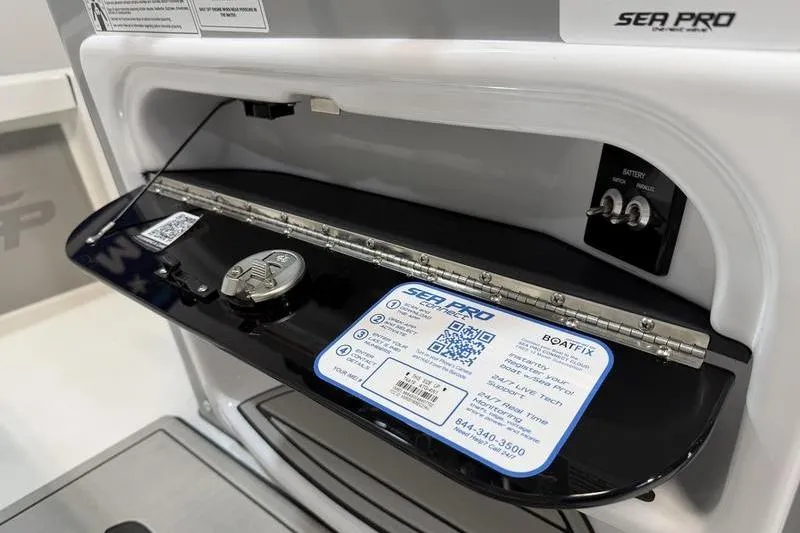 Slide: The Image of 2026 Sea Pro 210 Bay boat dashboard with control panel and informational label. - 15