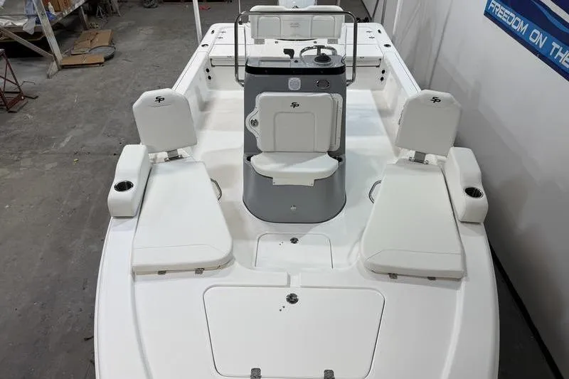 Slide: The Image of 2026 Sea Pro 210 Bay boat interior with seating and console, showcasing modern design. - 16
