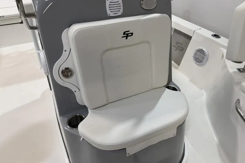 Slide: The Image of White seat on 2026 Sea Pro 210 Bay boat, featuring cup holders and sleek design. - 17