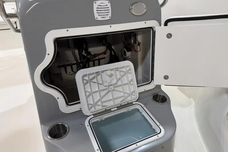 Slide: The Image of Open storage compartment on a 2026 Sea Pro 210 Bay boat, showcasing interior details. - 18
