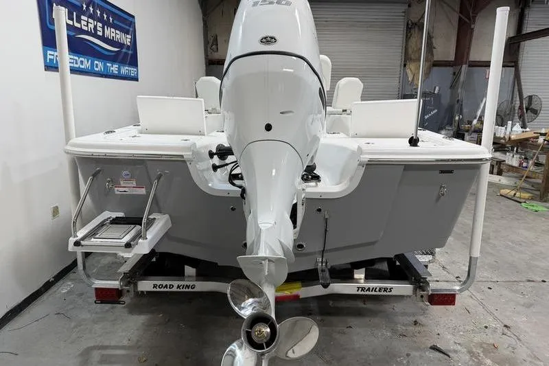 Slide: The Image of 2026 Sea Pro 210 Bay boat on trailer in a garage setting. - 5