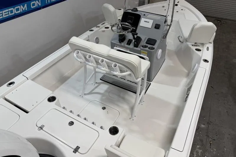 Slide: The Image of 2026 Sea Pro 210 Bay boat interior with console and seating arrangement. - 6